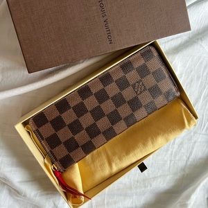 Louis Vuitton Clement Wallet in Monogram leather zip